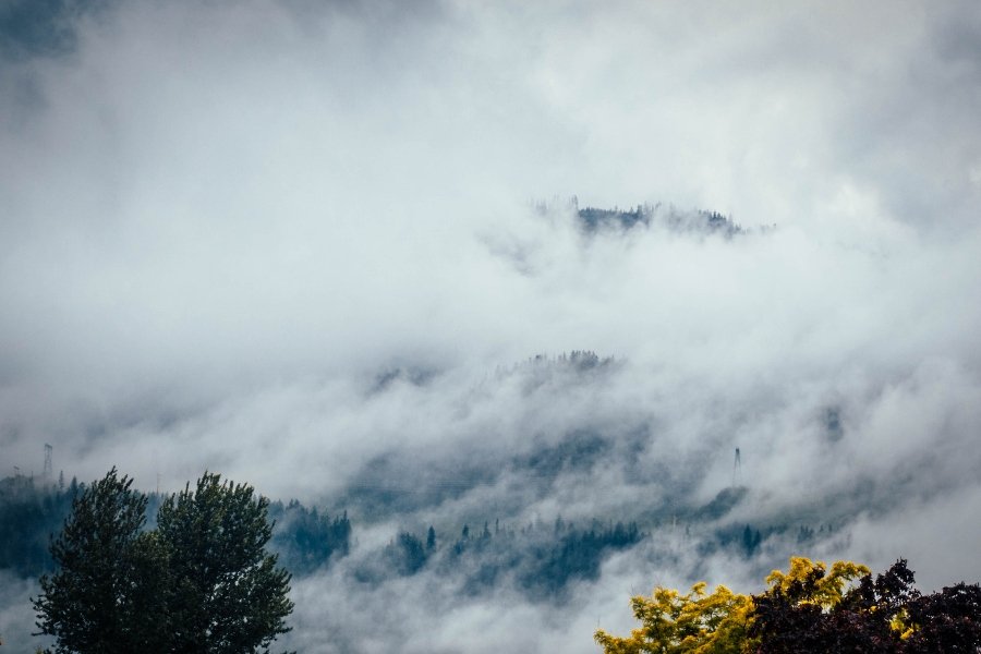 Clouds and mist swamp over a mountain in British Columbia