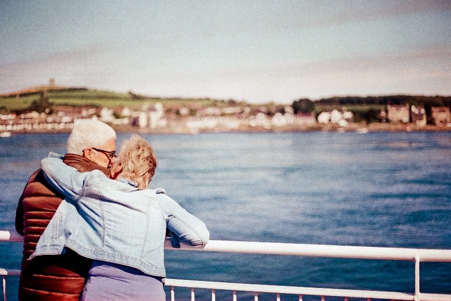 A couple embrace on a ferry to Strangford