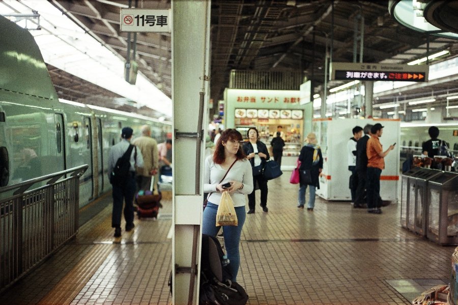 Girl waiting for a train in Tokyo