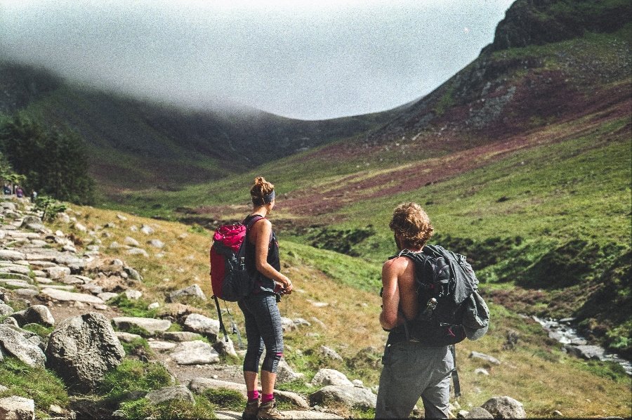 Two hikers observing their path up the Mourne Mountains